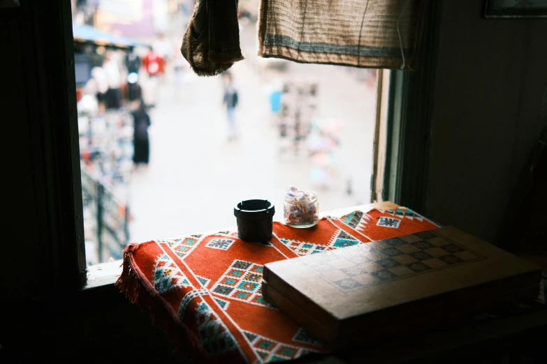 the sun shines brightly from a room's window in a city