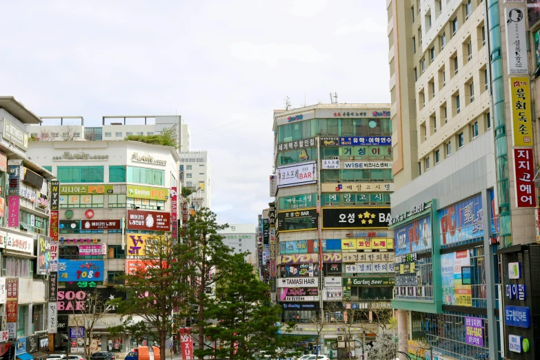 a large group of buildings with people walking around