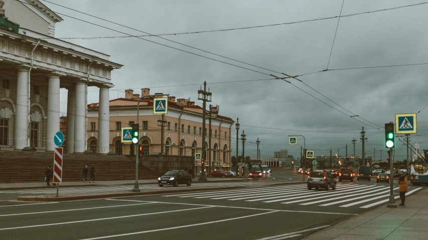 a street with traffic lights and buildings on either side