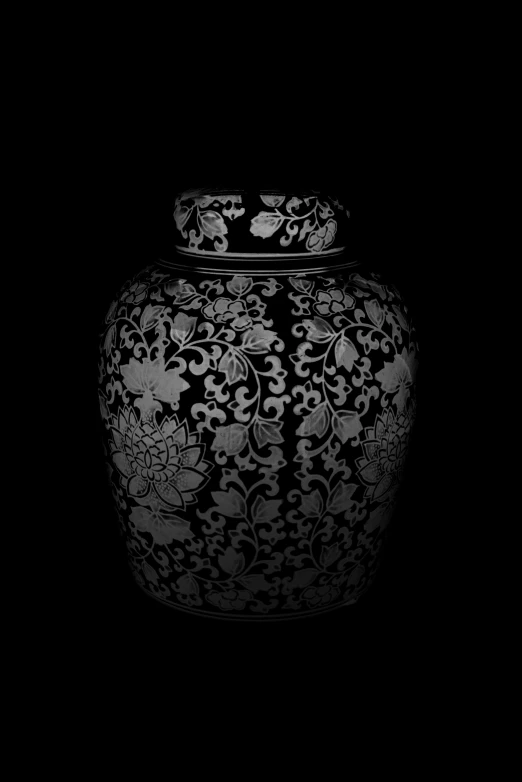an ornate, black and white vase sitting on a black background