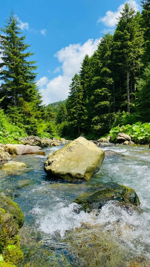 water rushing between some rocks in a river