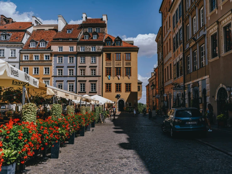 many people walking in the narrow city streets