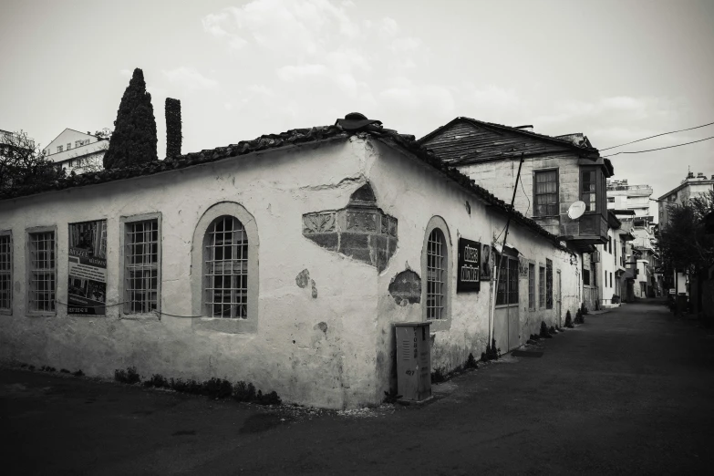 the exterior of an old building with several windows