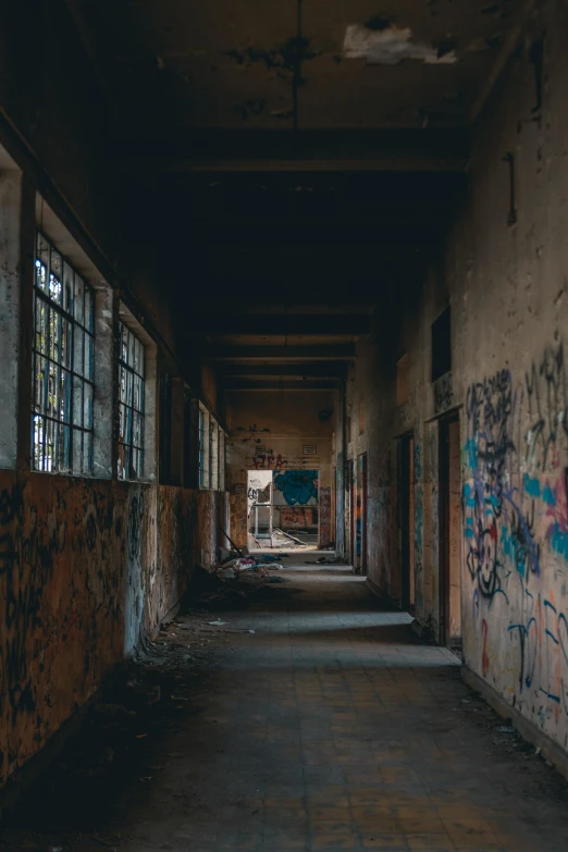 the inside of an abandoned building with graffiti