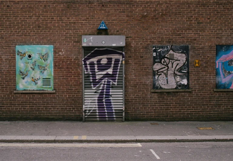 a building with a graffiti covered door that says'don't touch here '