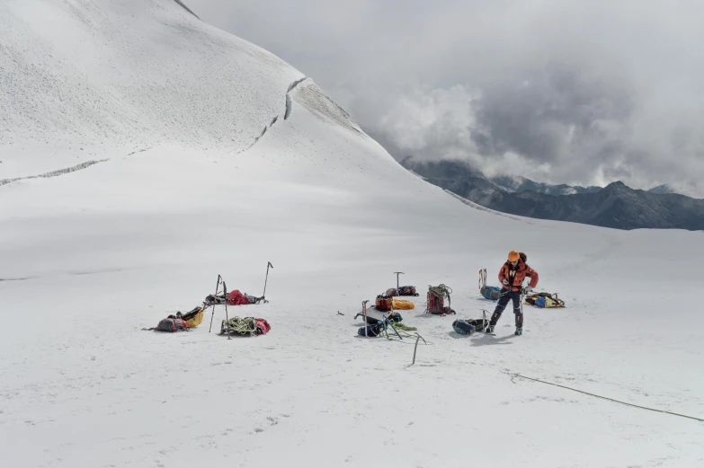 a group of people that are standing on a snowy hill