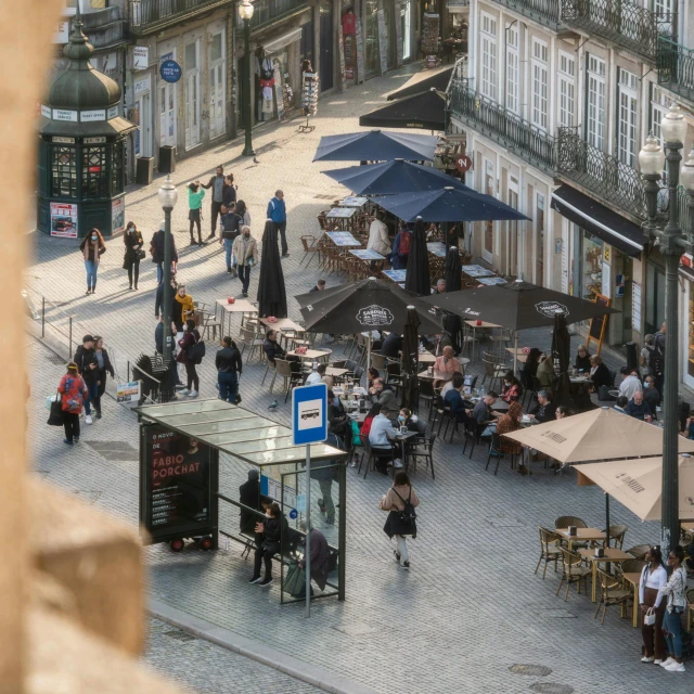 an aerial view of people walking through a city