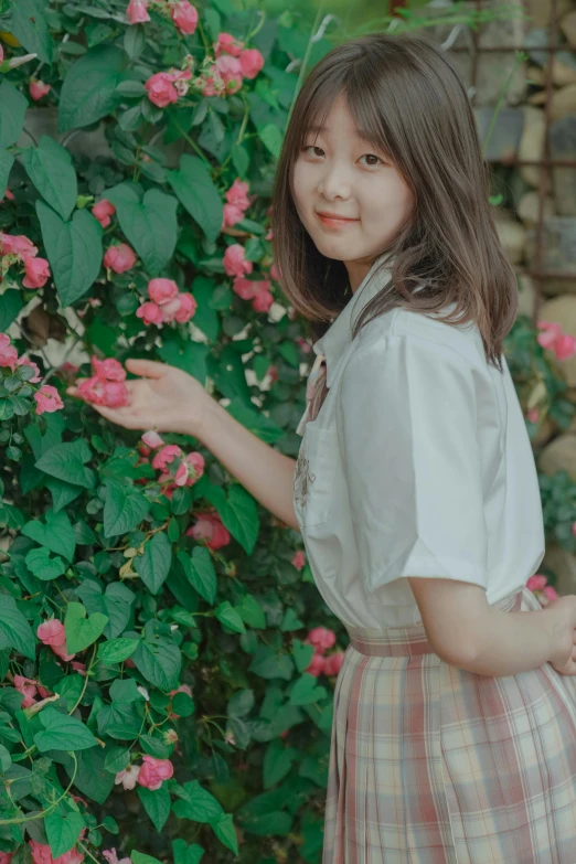 little girl with a flower in her hand and flowers around her neck