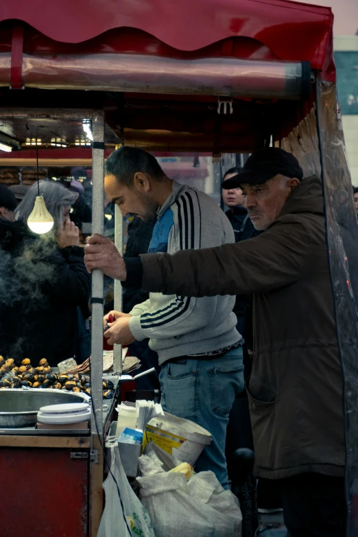 some men looking at a  dog on a cart