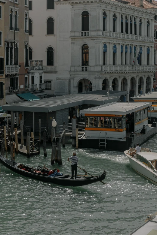 there is a long boat that has people riding it