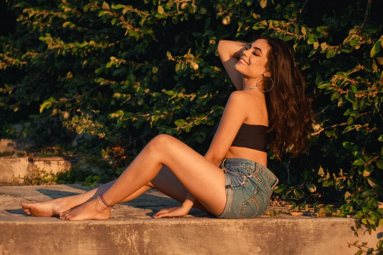 a young woman poses for the camera in her bikini top