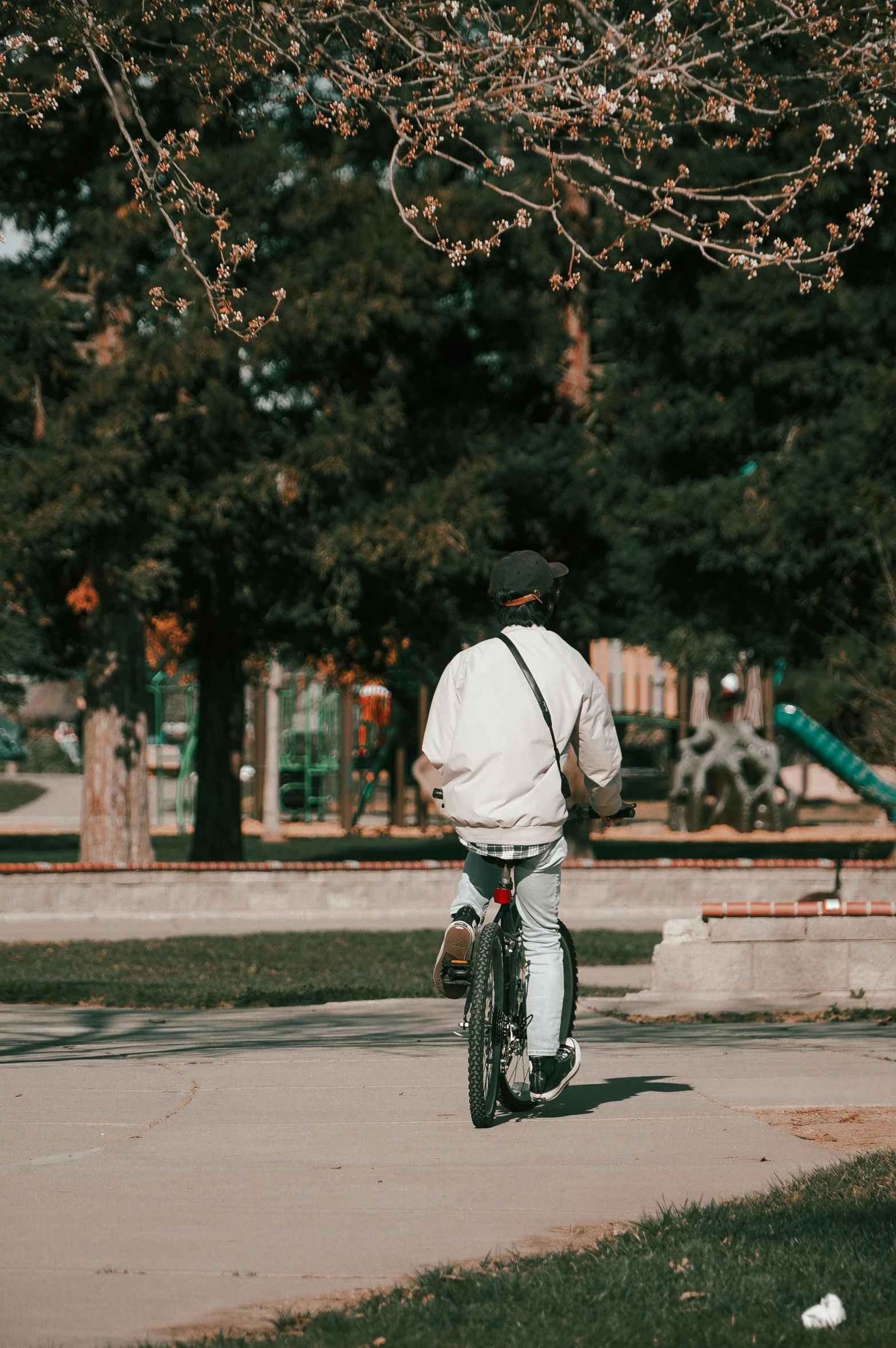 the person is riding a bike down the street