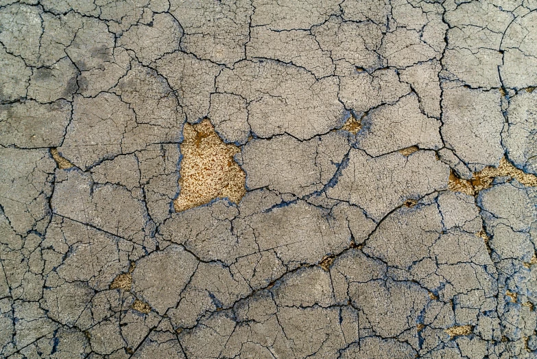 a grungy surface with brown dots and lines