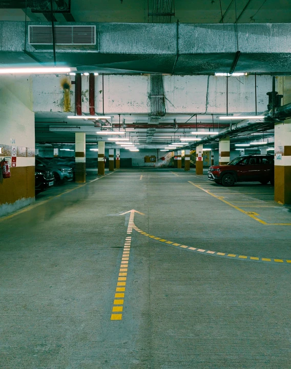 a parking garage with no doors on the outside and an attached fire hydrant