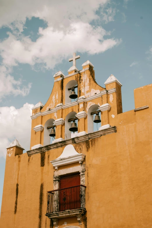 there is a tall building with a cross on the top