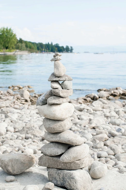 stacks of rocks sitting on top of each other on a rocky beach