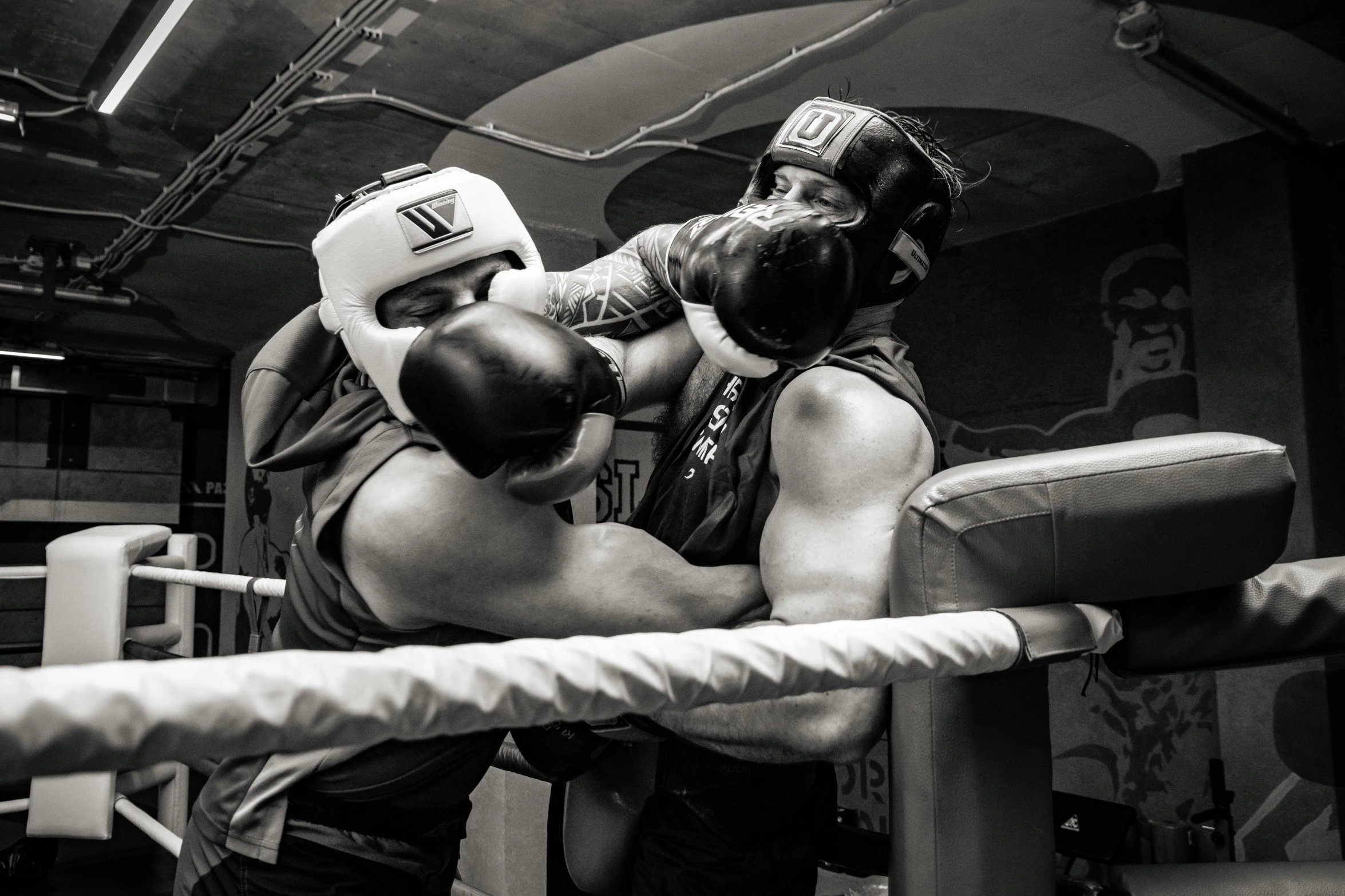 two boxers sparring their opponents in a gym