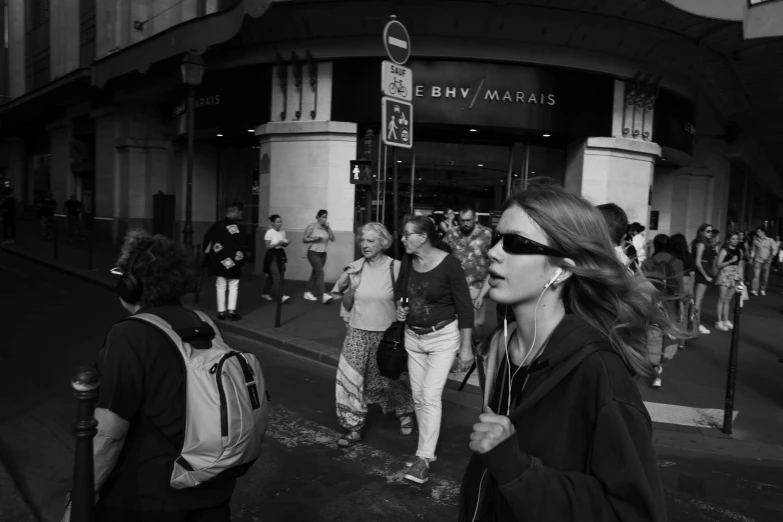 this is black and white of people walking in the street