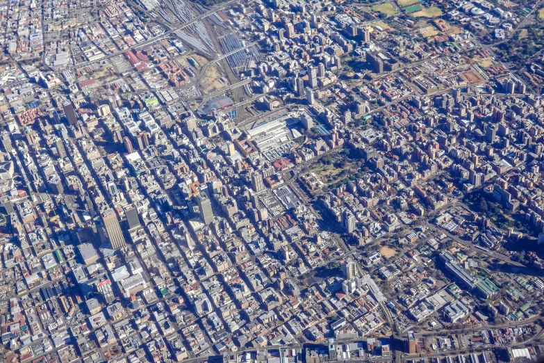 a city from the air showing it's rooftops and suburbs