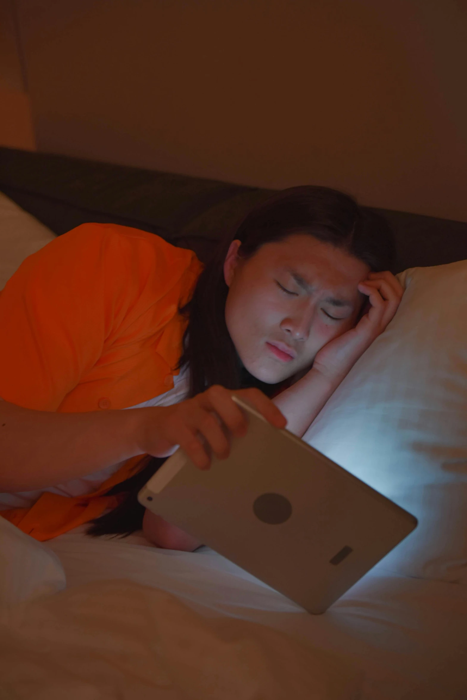 girl sleeping with a laptop on her stomach