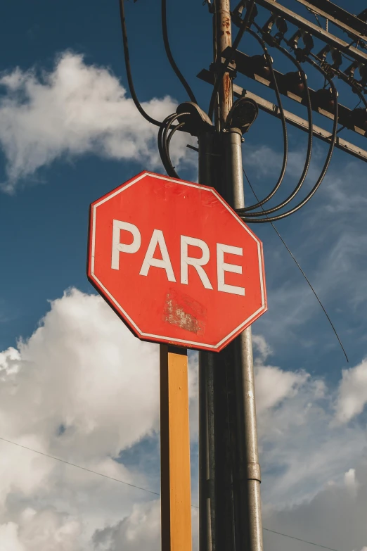 an overhead view of a street sign in the daytime