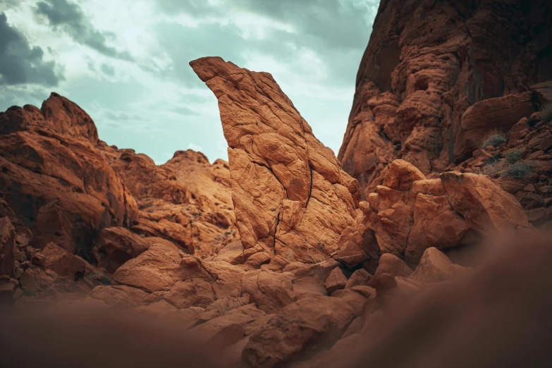 the mountain is covered in many rocks and sand