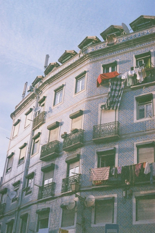 a large building with balconies and other windows