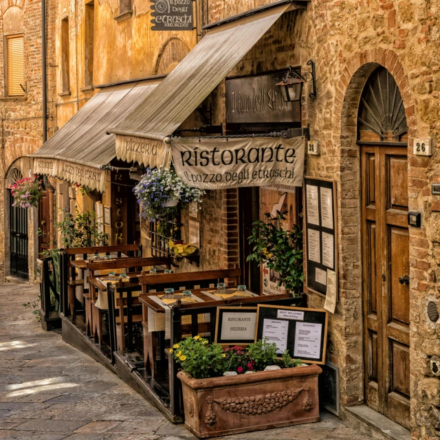 a building has flowers and some signs on the front