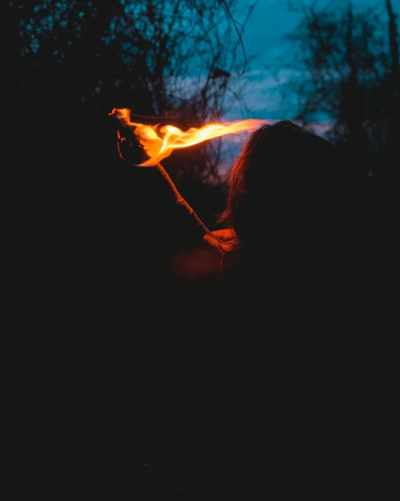 a woman is holding the handle of her fire hose