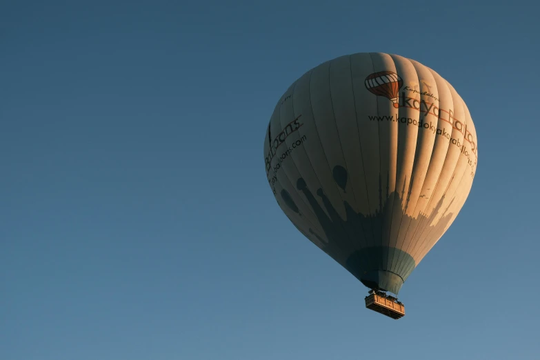 an in flight  air balloon flying across the sky