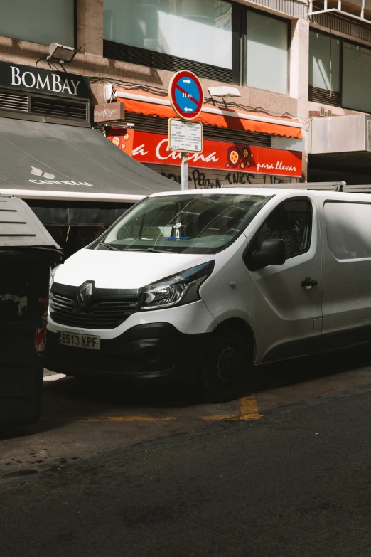 a van sitting on the side of a street