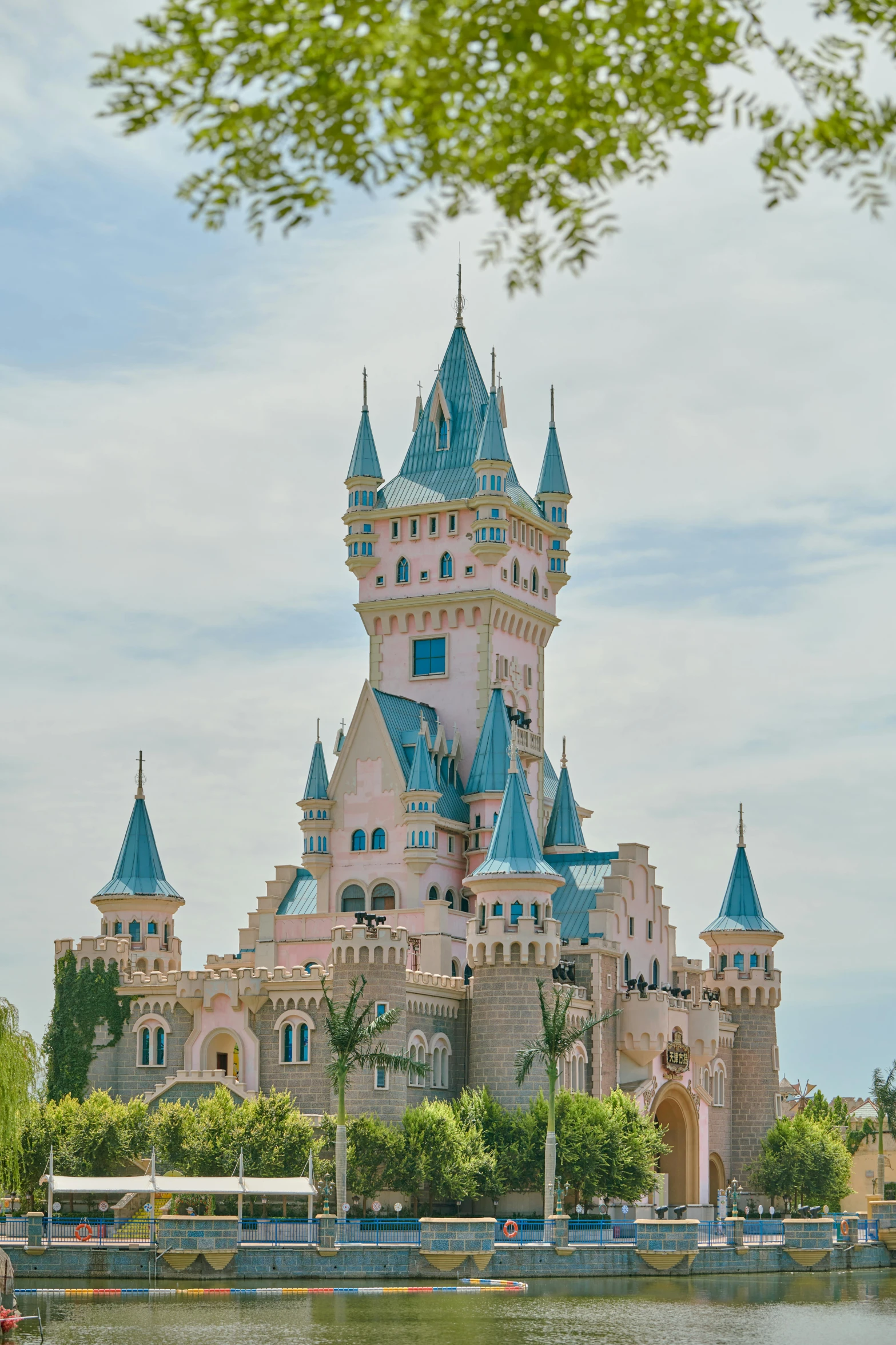 a large castle by some water in the day