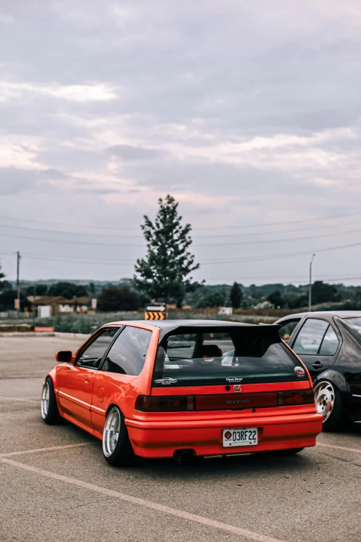 two cars are parked on the pavement