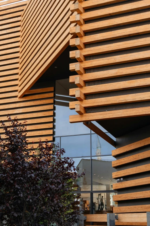 a large, wood building has been constructed over an apartment block