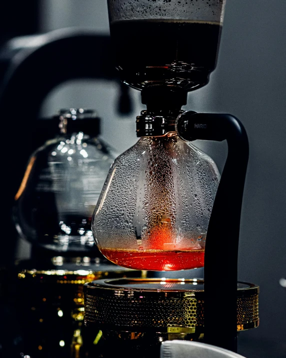 two coffee pot sitting on a coffee table