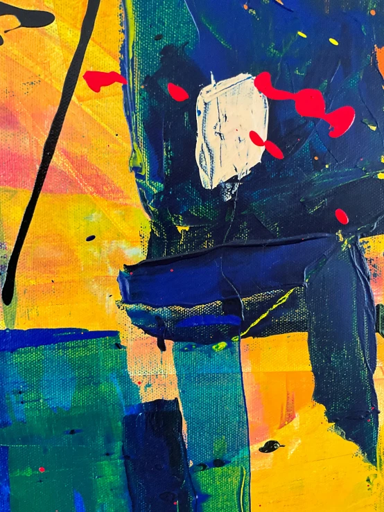 an abstract painting that includes bright yellow, blue and red