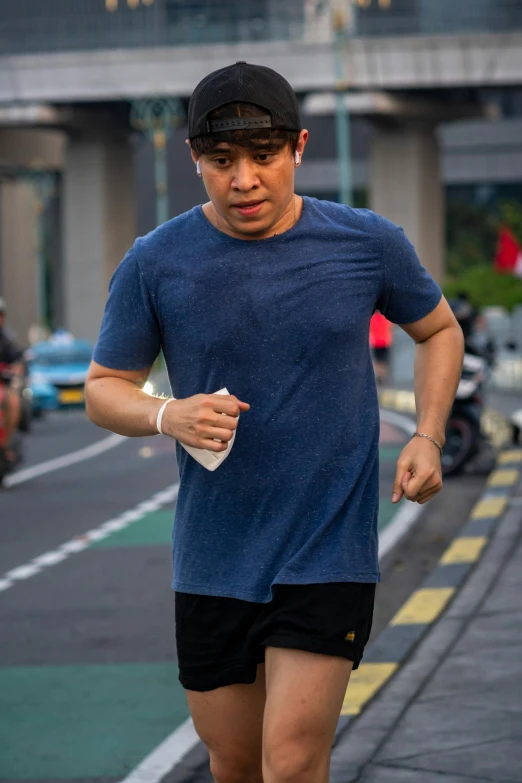 an image of a man running in the street