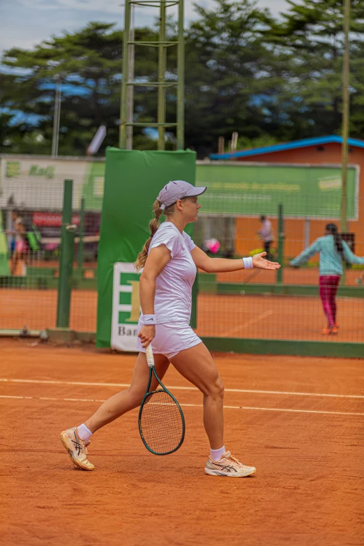 a woman tennis player with a racket during a match
