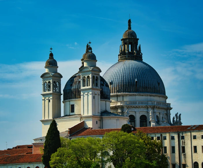 a large white building with three pointed towers on top