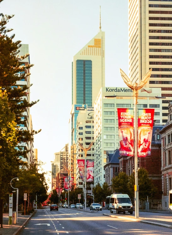 the street in the city has various advertising on it