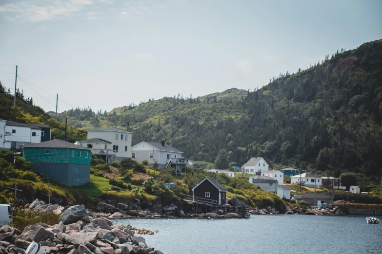 a village on the coast surrounded by mountains