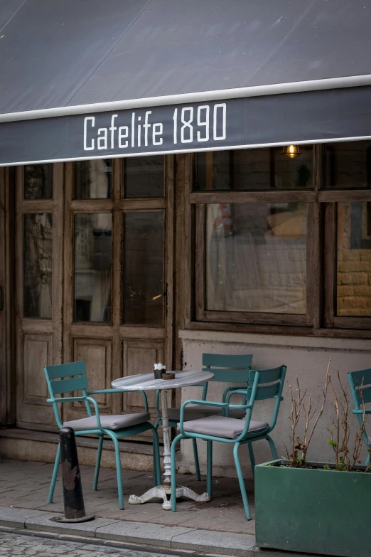 an image of a cafe sign hanging above tables