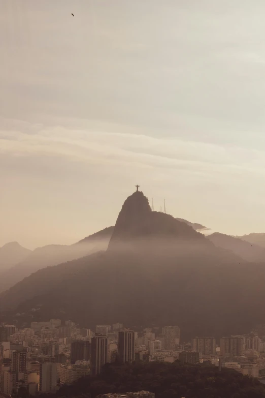 a very tall mountain with a city below it