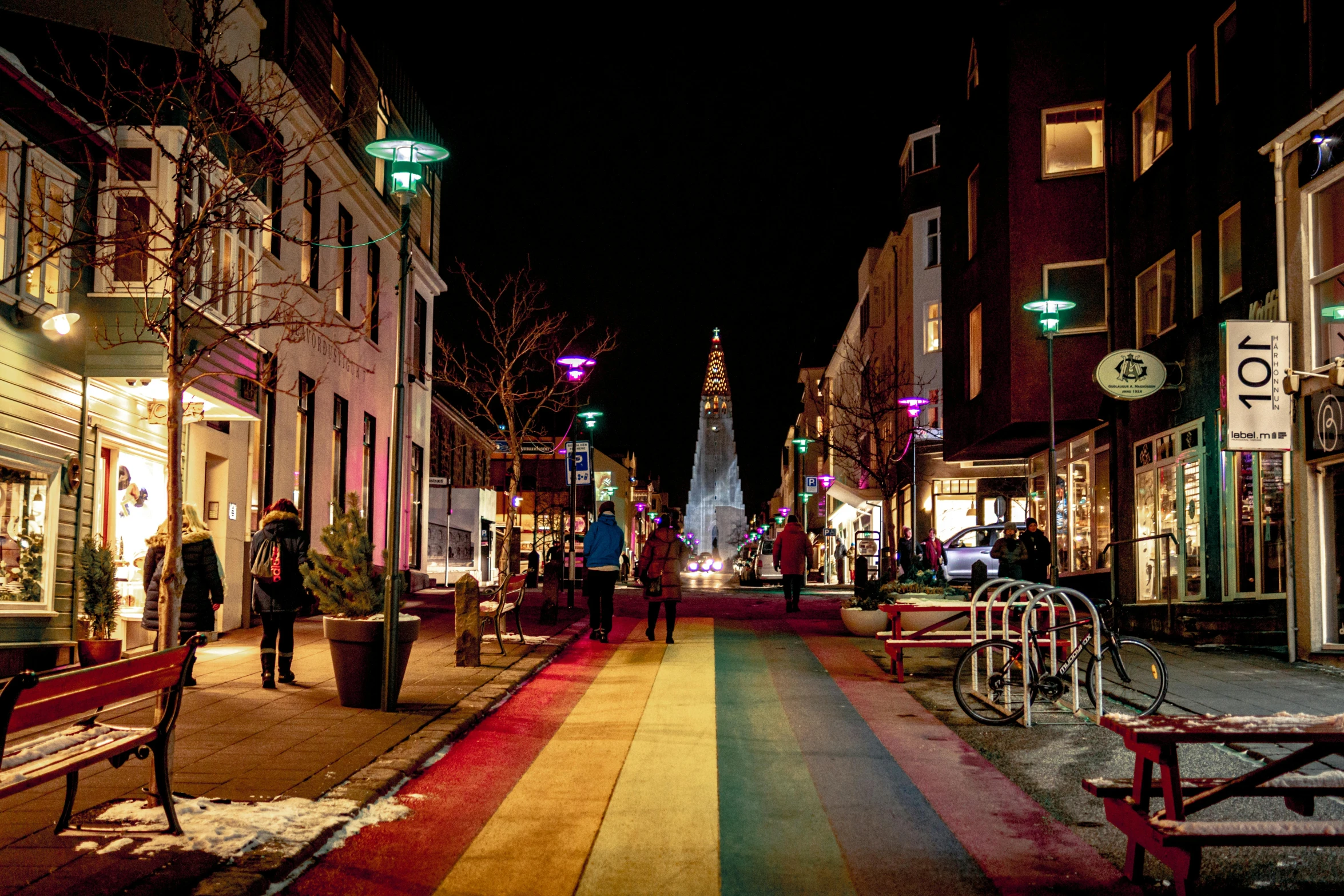 colorful painted lines on the pavement near stores