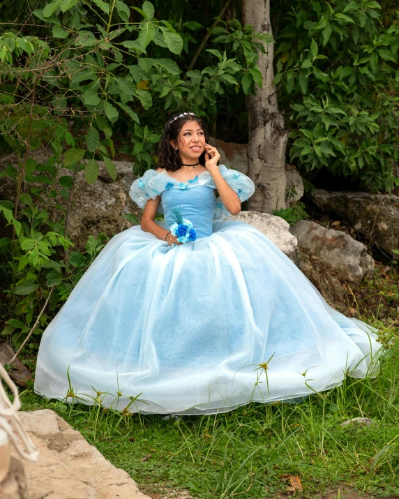 a little girl is dressed up in princess costume