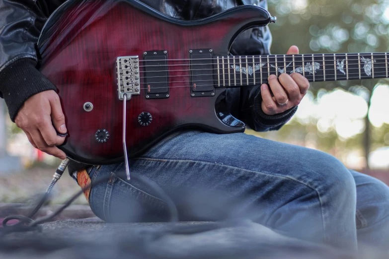 a person with a guitar and headphones on