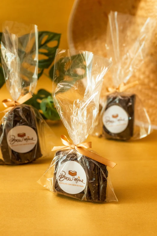 three little bags of chocolate sitting on top of a table