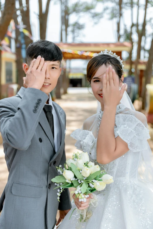 the man and woman are in grey wedding attire