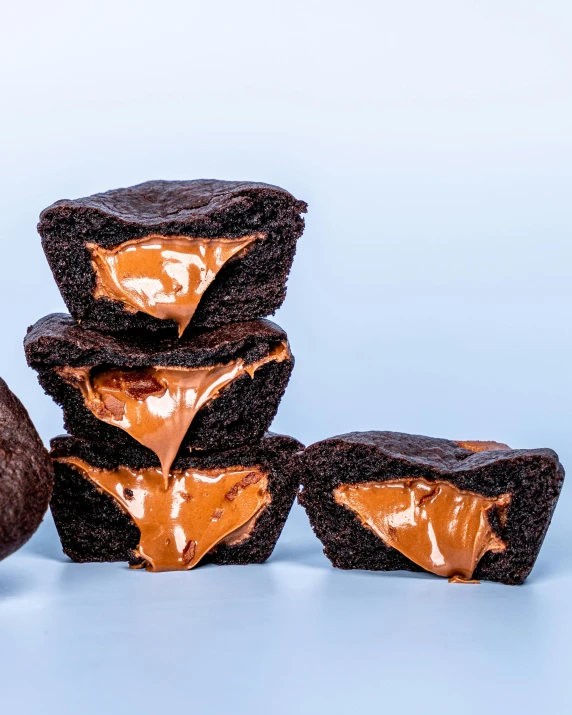 a pile of chocolate cookies sitting next to a donut