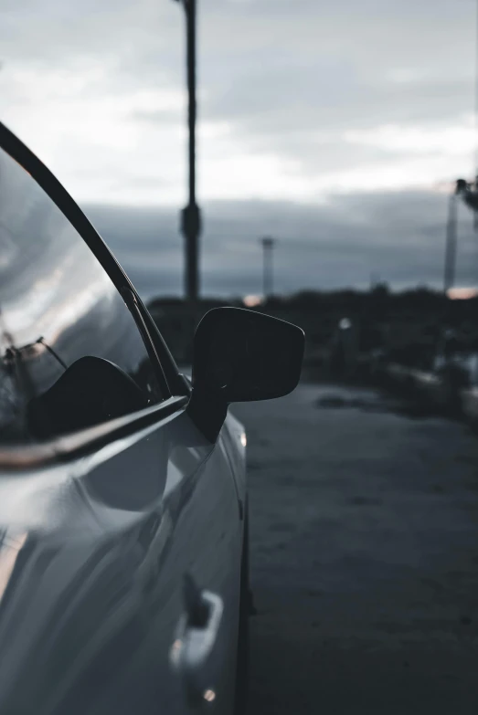 a parked car on a street near parking lights